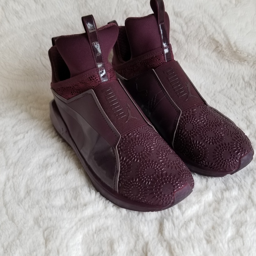 Burgundy Kylie Jenner puma tennis shoes.